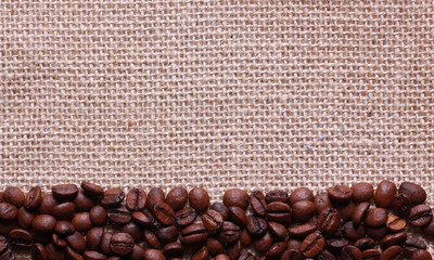 Roasted coffee beans on linen sackcloth