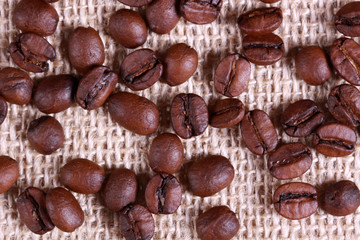 Roasted coffee beans on linen sackcloth