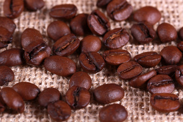 Roasted coffee beans on linen sackcloth