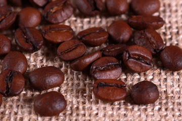Roasted coffee beans on linen sackcloth