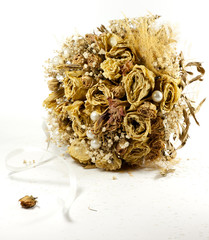 a bouquet of wilted flowers lay isolated on a white background