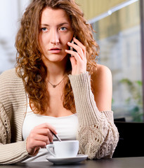 young woman is talking phone