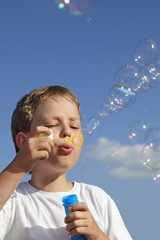 boy play in  bubbles