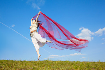 beautiful hippie girl with red fabric