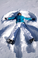 Woman doing the fresh snow angel