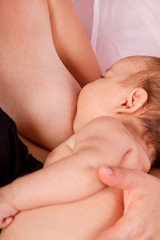 Fototapeta premium newborn baby and mom breast feeding