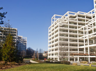 White Terraced Office with Bridge Under Blue Sky