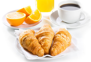 breakfast with croissants, juice and coffee