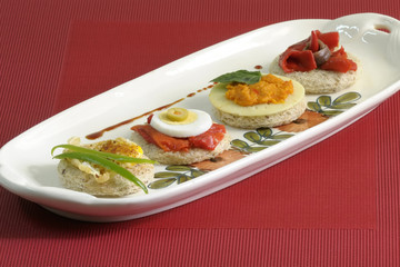 Canapes with eggs, peppers and pate