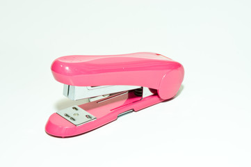 Pink stapler on a white background