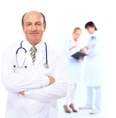 Smiling doctors with stethoscopes. Isolated over