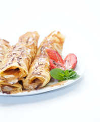 Pancake tubules with strawberry and glaze