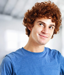 Smiling young guy having an idea