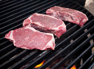 Steaks on barbecue