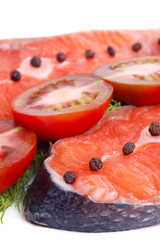 Fresh salmon served with tomato and pepper