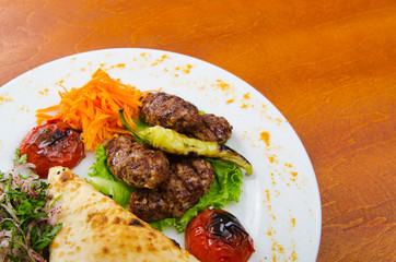 Meat cuisine - kebab served in plate