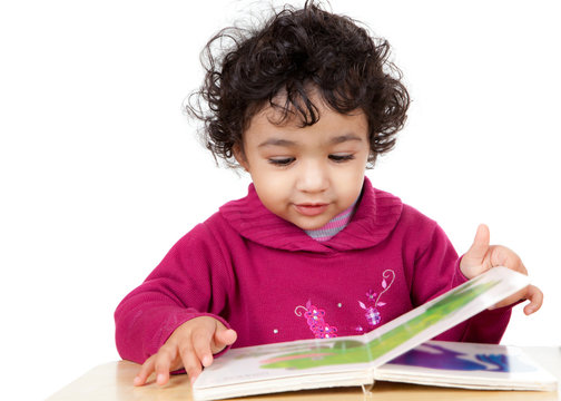 Toddler Girl Reading a Picture Book, Isolated, White