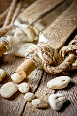 Bottles with stones. Vintage background