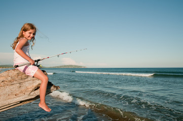 Fishing -  girl fishing at the beach