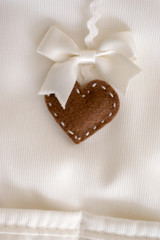 Heart plush fabric background with staple