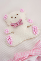 Teddy bear plush fabric background with staple