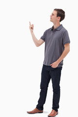 Man standing and presenting something above