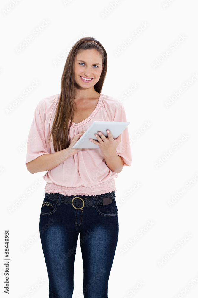 Poster smiling girl using a touchpad