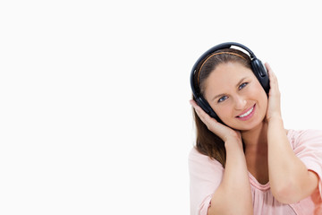Fototapeta premium Smiling girl wearing headphones