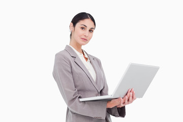 Side view of businesswoman with laptop
