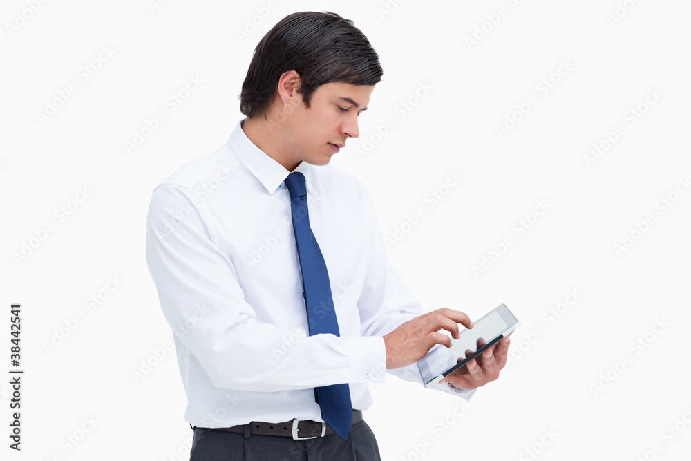 Poster Side view of tradesman using tablet computer