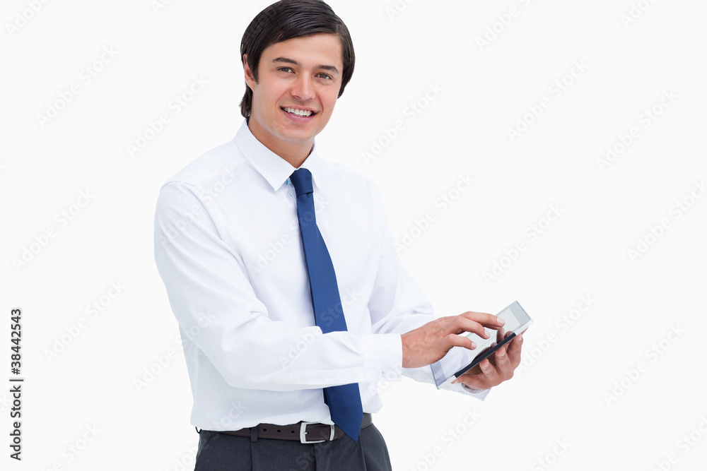 Poster Side view of smiling tradesman with his tablet computer