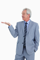 Mature tradesman looking at his palm