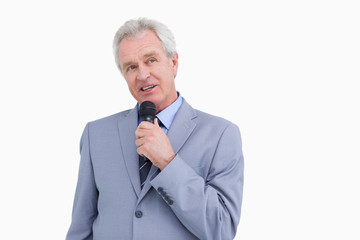 Naklejka premium Mature tradesman with microphone
