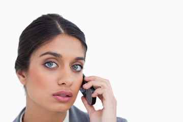 Close up of female entrepreneur listening to caller