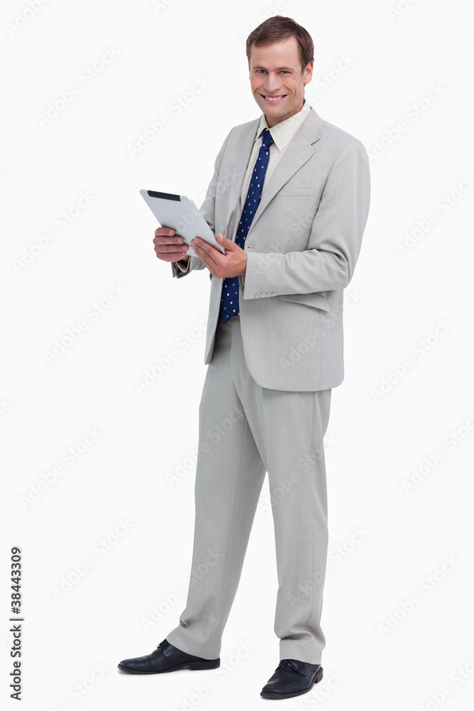 Poster smiling businessman with his tablet computer