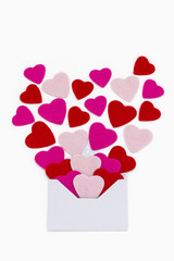 Small red and pink hearts with envelope