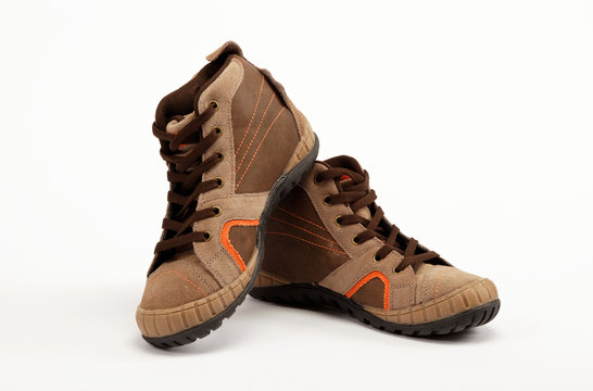 A pair of new hiking boots on white background