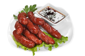 Grilled sausage with sauce and vegetables