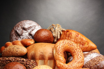 delicious bread on wooden table on gray background