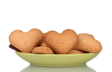 Heart-shaped cookies on green plate isolated on white