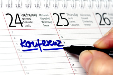 Kalender mit Eintrag Konferenz