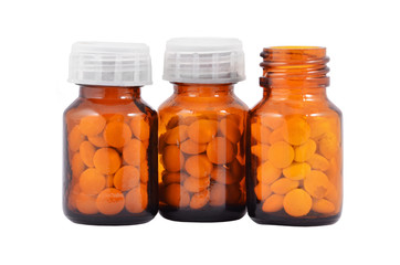 Pills in retro bottle, isolated on white background