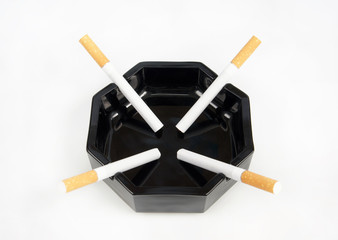 Four cigarettes lie in an ashtray. The concept of negotiations