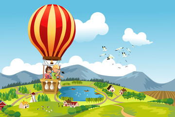 Obraz premium Dzieci jadące balonem