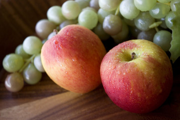 close up fresh apples and grapes