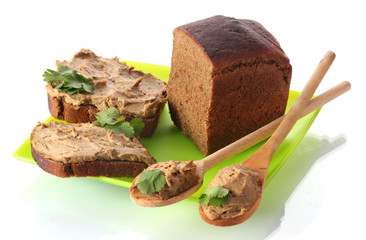 Fresh pate on bread on green plate isolated on white