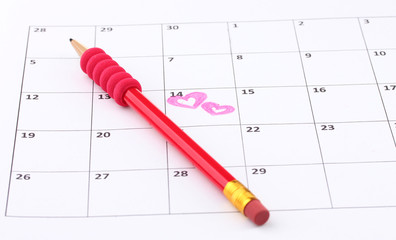 Calendar page with hearts and pencil on St.Valentines Day