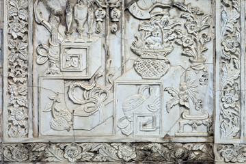 White stucco , thai style on the Wall