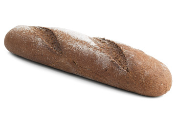 Loaf of black rye bread with flour