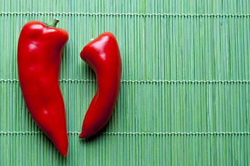Red peppers on green bamboo placemat